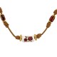 Collar con cordón trenzado y tubo de cerámica con flores
