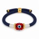 Pulsera con Ojo de Resina Rojo en Forma de Cubo y Cordón Azul