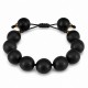 Pulsera con cuentas de madera negras y separadores metálicos dorados