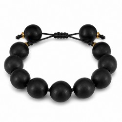 Bracelet avec perles en bois noir et entretoises en métal doré