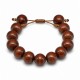 Pulsera con cuentas de madera marrones y separadores metálicos dorados