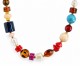Collana con Perline Asimmetriche Multicolori e Punte Dorate