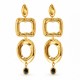 Boucles d’oreilles avec émail noir et éléments géométriques dorés