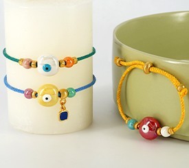 BRACELETS W/ EVIL EYES