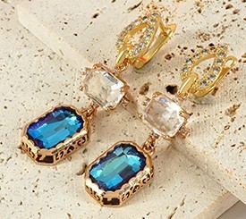 EARRINGS W/ BLUE CHARM