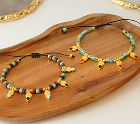 BRACELETS W/ GOLD CHARMS