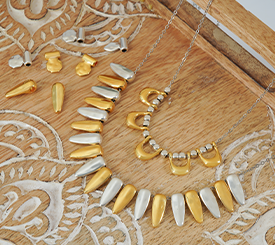 NECKLACES W/ ETHNIC CHARMS