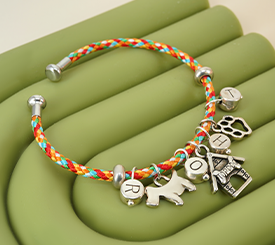 CORD BRACELET W/DOG CHARMS